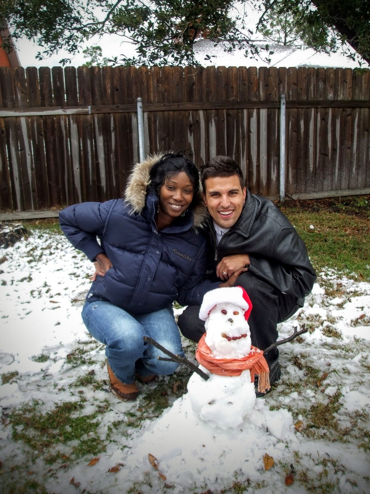 Married After Four Months Tenaj and Tino Next To A Snowman They Made
