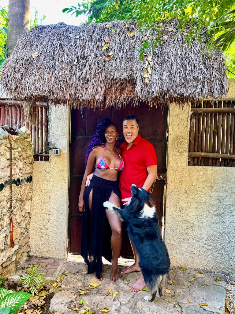 Tulum Money Saving Tips Tenaj And Tino Travel Couple Front Of Home In Mexico With A Dog